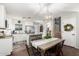 A kitchen and dining area with stainless steel appliances, an island, and a dining table at 337 S Leandro --, Mesa, AZ 85208