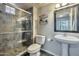 Stylish bathroom featuring a glass enclosed shower, pedestal sink, and modern decor at 3434 E Avalon Dr, Phoenix, AZ 85018