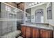 Elegant bathroom with a glass-enclosed shower, granite countertop, and tiled walls for a spa-like experience at 3434 E Avalon Dr, Phoenix, AZ 85018