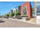 Colorful townhouses with garages, balconies, and inviting curb appeal at 3434 E Avalon Dr, Phoenix, AZ 85018