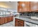 Open floor plan of Kitchen and Living Room showcases the layout and granite counters at 3434 E Avalon Dr, Phoenix, AZ 85018