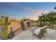 Outdoor living area featuring a beautiful fireplace and comfortable seating at 37505 N 104Th Pl, Scottsdale, AZ 85262