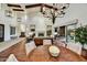 Open-concept living room with high ceilings, hardwood floors, and a view of the backyard at 37505 N 104Th Pl, Scottsdale, AZ 85262