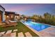 Resort-style pool with a waterfall feature and desert landscaping, ideal for relaxation at 37505 N 104Th Pl, Scottsdale, AZ 85262