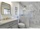 Bathroom with a marble walk-in shower, elegant vanity, and high-end fixtures at 4026 N 81St St, Scottsdale, AZ 85251