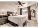 This bedroom features a ceiling fan, decorative mirror, and dresser at 4026 N 81St St, Scottsdale, AZ 85251