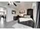 Bedroom with gray laminate floors, a workstation, a golf art piece, and neutral walls at 4026 N 81St St, Scottsdale, AZ 85251