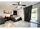 Bedroom featuring a ceiling fan, neutral walls, and a sliding door leading to the backyard at 4026 N 81St St, Scottsdale, AZ 85251