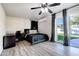 Bedroom featuring a ceiling fan, a workstation, a golf art piece, and neutral walls at 4026 N 81St St, Scottsdale, AZ 85251