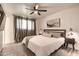 This well-lit bedroom offers a comfortable space with a ceiling fan and stylish furnishings at 4026 N 81St St, Scottsdale, AZ 85251