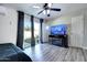 Bedroom featuring gray floors, light walls, and a tv atop a fireplace cabinet at 4026 N 81St St, Scottsdale, AZ 85251