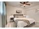 This bright bedroom features a ceiling fan, bedside tables, and a cozy atmosphere for restful nights at 4026 N 81St St, Scottsdale, AZ 85251