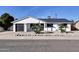 Well-maintained single-story home with desert landscaping and a dark grey roof at 4026 N 81St St, Scottsdale, AZ 85251