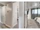 Hallway with view of a bathroom and a bedroom with curtains at 4026 N 81St St, Scottsdale, AZ 85251