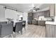 Open-concept kitchen and dining area featuring stainless appliances and stylish wood cabinets at 4026 N 81St St, Scottsdale, AZ 85251