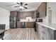 Modern kitchen with stainless steel appliances and wood floors at 4026 N 81St St, Scottsdale, AZ 85251