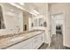 Elegant bathroom with double sinks, granite countertops, modern fixtures, and access to a laundry area at 4027 E Mark Ln, Cave Creek, AZ 85331