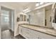 Elegant bathroom featuring double sinks, granite countertops, and stylish fixtures, plus a shower at 4027 E Mark Ln, Cave Creek, AZ 85331