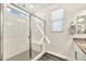 Modern bathroom with large glass shower, and tile, with granite countertop vanity with double sinks at 4027 E Mark Ln, Cave Creek, AZ 85331