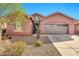 Charming single-story home featuring a stucco facade, desert landscaping, and an attached two-car garage at 4027 E Mark Ln, Cave Creek, AZ 85331