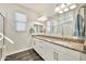 Bathroom featuring double sinks, granite countertop, modern vanity and mirror, and large walk-in shower at 4027 E Mark Ln, Cave Creek, AZ 85331