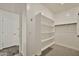 Spacious walk-in closet featuring built-in shelving and plenty of room for clothes storage and organization at 4027 E Mark Ln, Cave Creek, AZ 85331