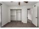 Bedroom showcasing a closet, ceiling fan, neutral paint, and connecting rooms at 461 W Holmes Ave # 277, Mesa, AZ 85210