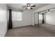 Bedroom featuring a ceiling fan, window and mirrored closet doors at 461 W Holmes Ave # 277, Mesa, AZ 85210