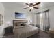 Comfortable bedroom with a ceiling fan, neutral paint, and coordinated furniture at 461 W Holmes Ave # 277, Mesa, AZ 85210