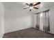 Bedroom featuring a ceiling fan, neutral paint, and ample natural light at 461 W Holmes Ave # 277, Mesa, AZ 85210