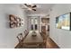 Bright dining area with wood floors, stylish decor, and a view into the adjacent kitchen at 461 W Holmes Ave # 277, Mesa, AZ 85210