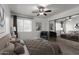 Well-appointed main bedroom featuring coordinated furniture, ceiling fan, and mirrored closet doors at 461 W Holmes Ave # 277, Mesa, AZ 85210