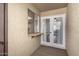 Private patio with a bar and open doorway to the unit's interior at 461 W Holmes Ave # 277, Mesa, AZ 85210