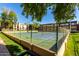 Well-maintained tennis courts surrounded by lush greenery and apartment buildings in a vibrant community setting at 461 W Holmes Ave # 277, Mesa, AZ 85210