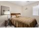 Bedroom with neutral carpet, a side table, and a window that provides natural light at 4760 E Amber Sun Dr, Cave Creek, AZ 85331