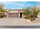 Single-story home boasting desert landscaping, a driveway, and a convenient two-car garage at 4760 E Amber Sun Dr, Cave Creek, AZ 85331