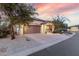 Single-story home featuring desert landscaping, a driveway, and a spacious two-car garage at 4760 E Amber Sun Dr, Cave Creek, AZ 85331