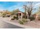 Charming desert landscaping surrounds the exterior of this single-story home with a 2-car garage at 4760 E Amber Sun Dr, Cave Creek, AZ 85331