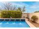 Backyard pool showcasing fountains surrounded by lush greenery for a tranquil and refreshing outdoor space at 4760 E Amber Sun Dr, Cave Creek, AZ 85331