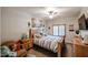 Cozy bedroom featuring a ceiling fan, a chair with a side table and a window with shutters at 5350 E Deer Valley Dr # 2236, Phoenix, AZ 85054