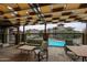 Inviting outdoor patio space with comfortable seating and a view of the sparkling community pool at 5350 E Deer Valley Dr # 2236, Phoenix, AZ 85054