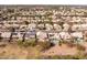 Aerial view of neighborhood featuring desert landscaping, pools, and solar panels at 5381 W Del Rio St, Chandler, AZ 85226