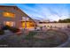 Expansive backyard showcasing a beautiful pool, lush greenery, and a covered patio, ideal for relaxation at 5381 W Del Rio St, Chandler, AZ 85226