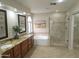 Bathroom features double sinks, granite counters, soaking tub, and tiled shower at 5381 W Del Rio St, Chandler, AZ 85226