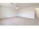 Spacious bedroom features a ceiling fan and a view into an adjoining room through a doorway at 5381 W Del Rio St, Chandler, AZ 85226