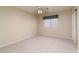 A simple, carpeted bedroom with a ceiling fan and a standard window at 5381 W Del Rio St, Chandler, AZ 85226