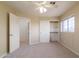 Bright, carpeted bedroom with large closet and open door at 5381 W Del Rio St, Chandler, AZ 85226