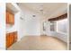 Bright dining area with tile flooring, vaulted ceilings, a ceiling fan, and natural light from large windows at 5381 W Del Rio St, Chandler, AZ 85226