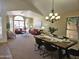 Open-concept dining area with a dining table set for six, great for entertaining at 5381 W Del Rio St, Chandler, AZ 85226