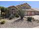 Inviting two-story home featuring desert landscaping with mature plants and a two-car garage at 5381 W Del Rio St, Chandler, AZ 85226